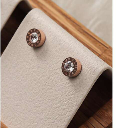 a pair of studs with a wooden frame.