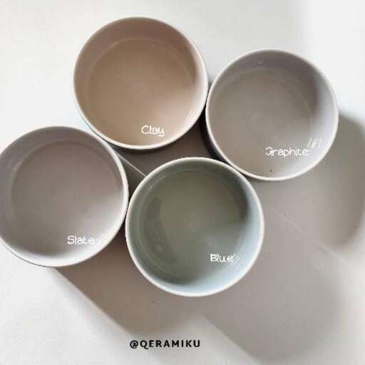 a set of three bowls with different designs on them.