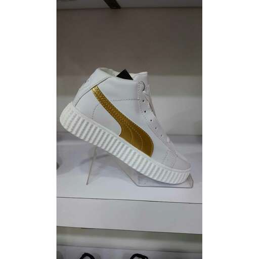 the shoe is available in white, gold and black.