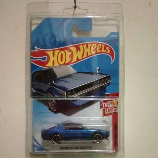 a toy car and a car in a plastic bag.