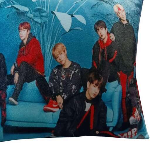 a pillow with a picture of a boy and a girl on it.