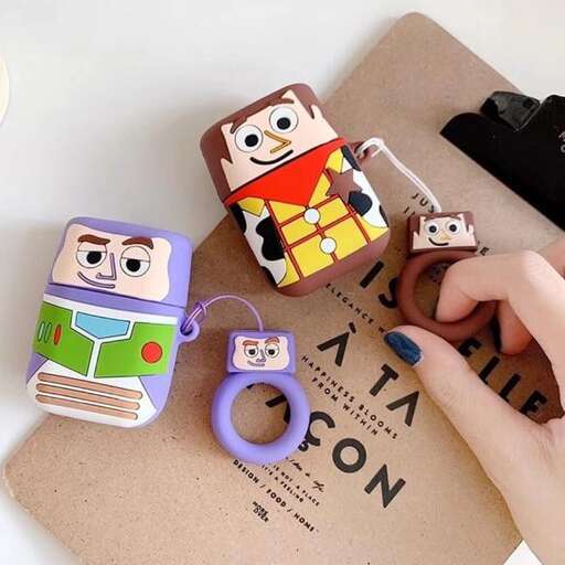 a hand holding a pair of scissors and a pair of scissors.