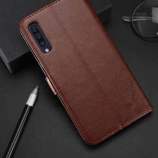 a leather case with a pen and a pen on it.