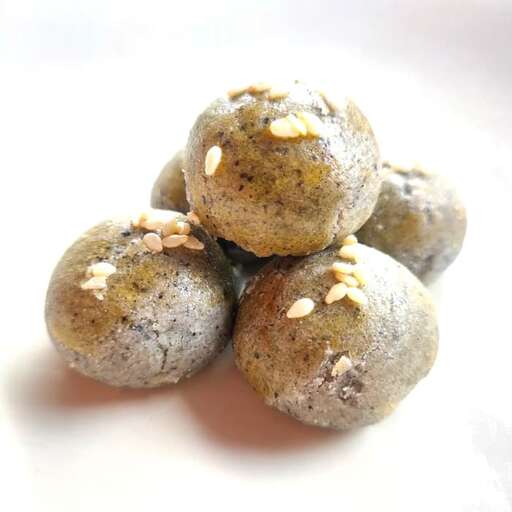 a group of cookies sitting on top of a white surface.