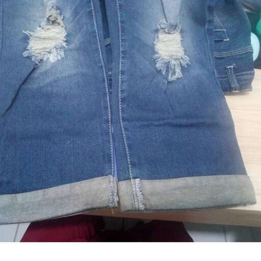 denim jacket with a hole in the back