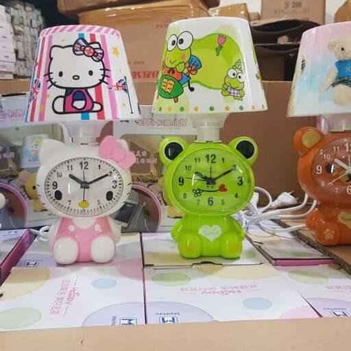 a display of various colorful stuffed animals and clocks.