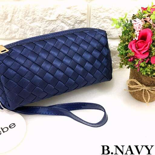 a small purse with a flower pot and a flower pot.