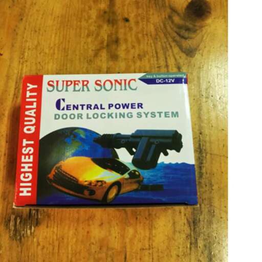 a box of computer parts on a wooden table.