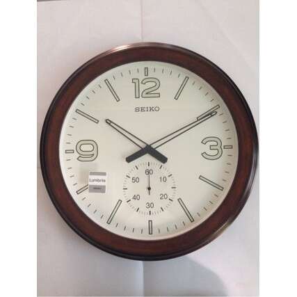 a clock with a wooden frame and a brown wooden frame.