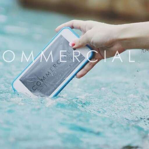 a woman holding a cell phone in her hand