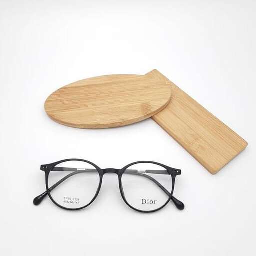a pair of glasses with a wooden spoon.