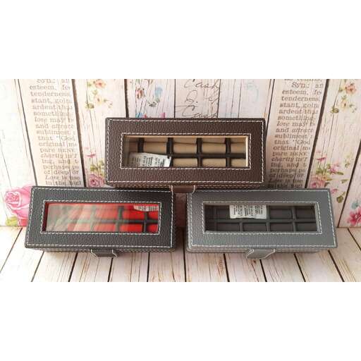 a set of two small boxes with a glass top and a mirror in the middle.