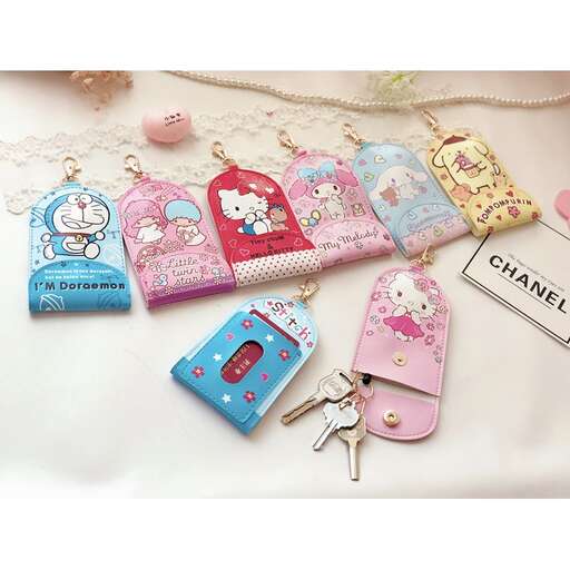 a collection of keys and keychains for a girl's birthday party.