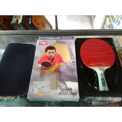 a plastic toy with a spatula and a plastic spoon in it.