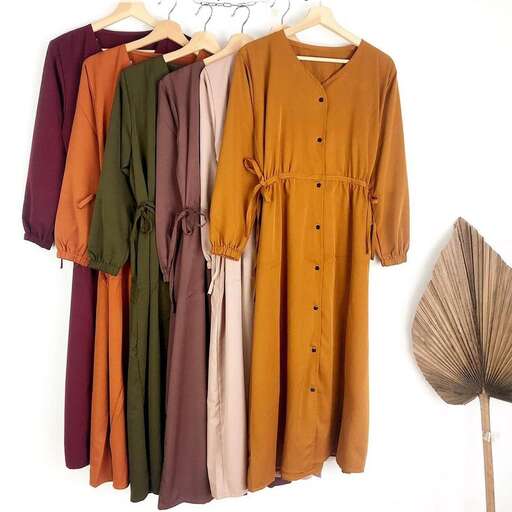 a dress made of brown linens and a feather.