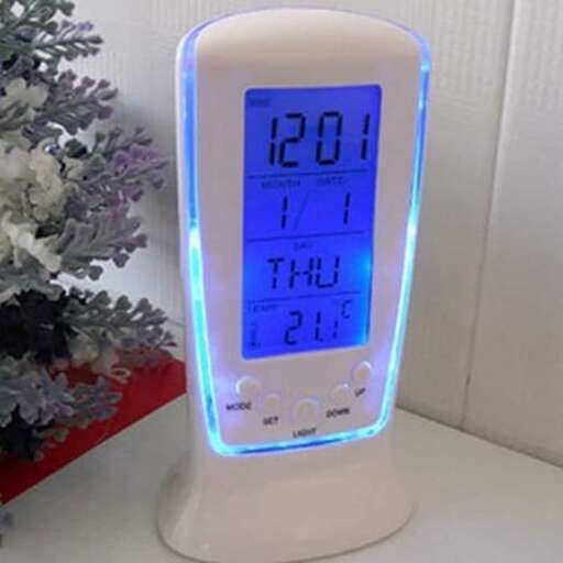 a clock with a blue led light on it.