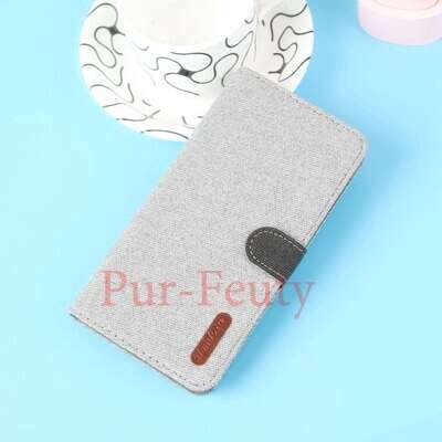 a cell phone with a face on it's case.