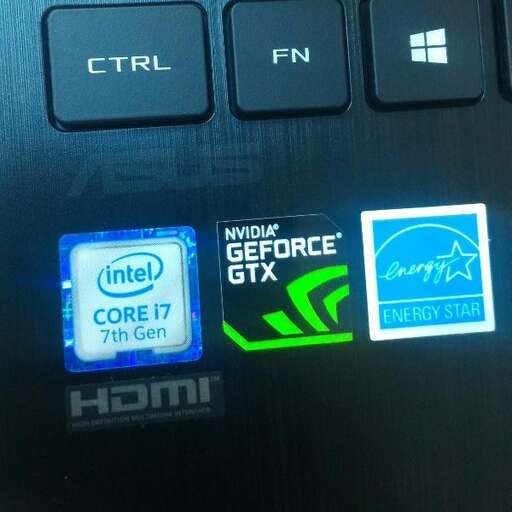 a computer keyboard with a blue and green logo.