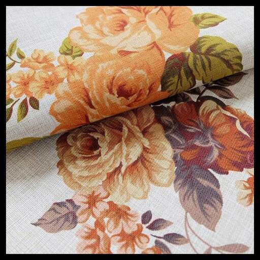 this is a close up of the flowers on the tablecloth.