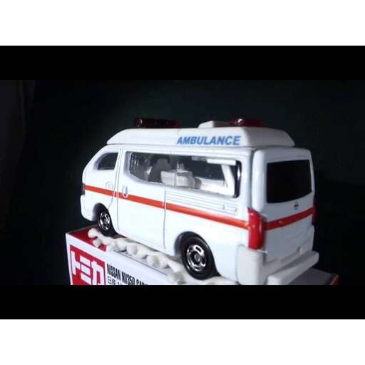 a toy ambulance with an ambulance on top of it.