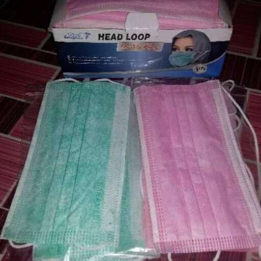 a box of towels with a headband on top of it.