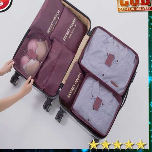 a person opening a suitcase with a star shaped box.