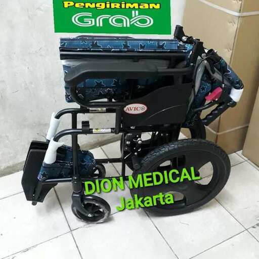 a wheelchair with a medical aid on the back