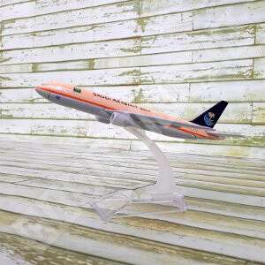 a model of an airplane flying over a wooden deck.