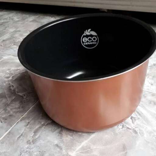 a stainless steel bowl with a lid.