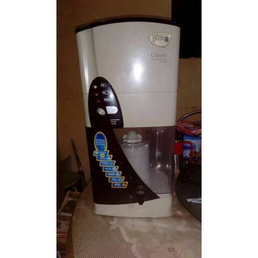a water dispenser with a picture of a blue design.