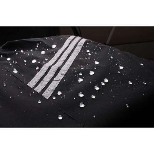 the snow is falling down on the jacket.