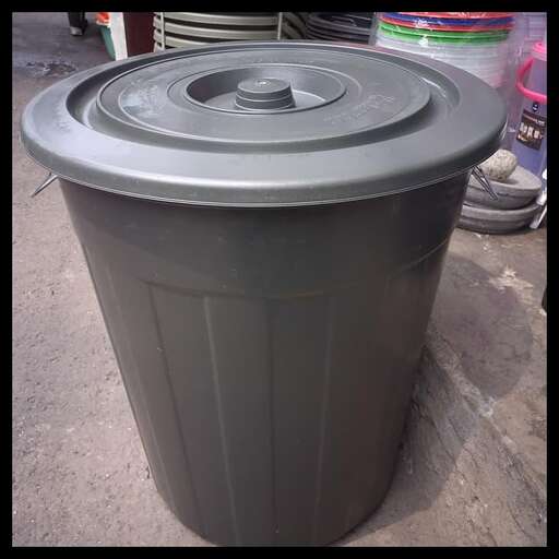 a plastic trash can with a lid on it.