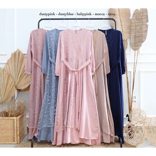 a rack of dresses and hats with hooks.