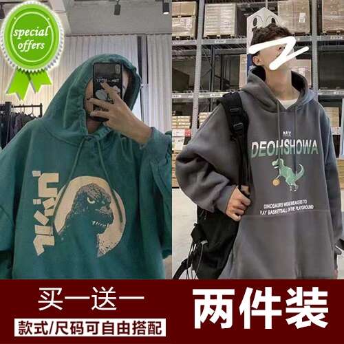 a man wearing a hoodie and sunglasses.