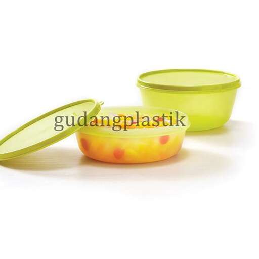 a green bowl with a lid and a spoon