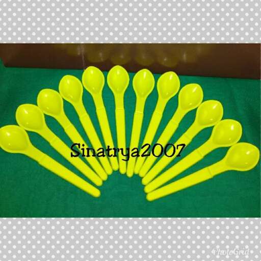 yellow spoons in a row