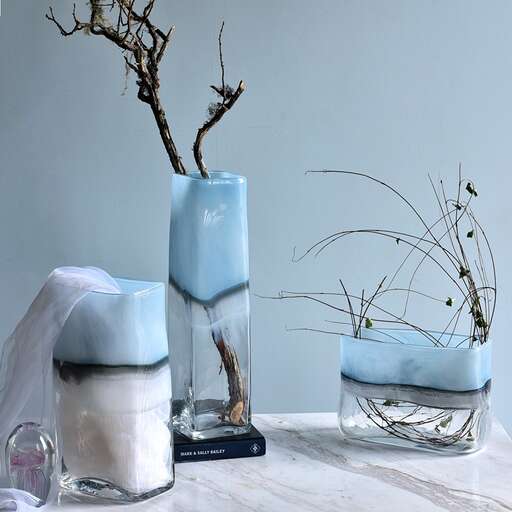 a table with two chairs and a candle.