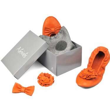 orange slippers in a box