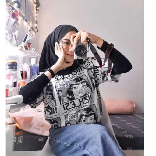 a woman taking a picture of herself in a mirror.