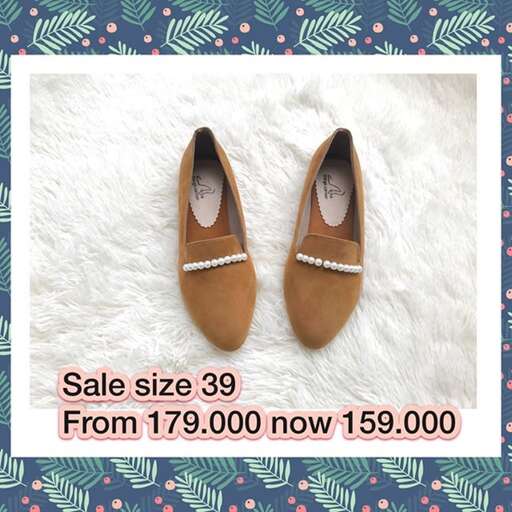 brown shoes with silver beads in the middle