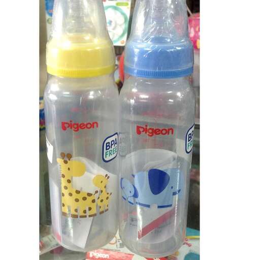 a baby bottle and baby bottles on a table.