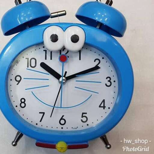 a blue clock with a face on it.