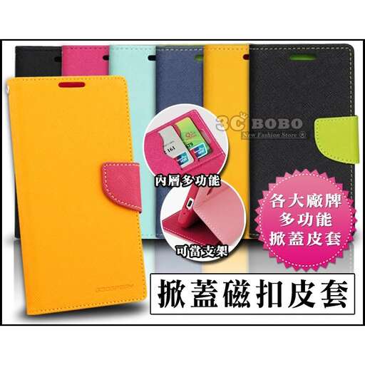 a large yellow notebook with a pink and blue cover.