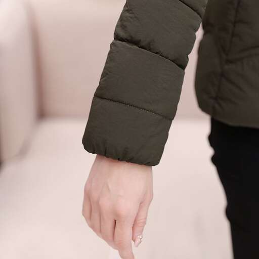 a woman is holding a stick in her hand.