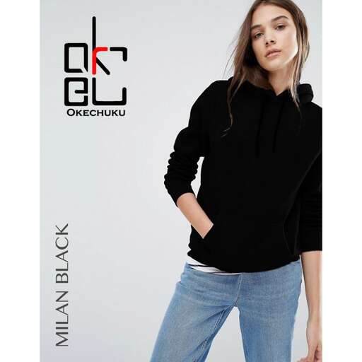 a model in a black sweater and jeans