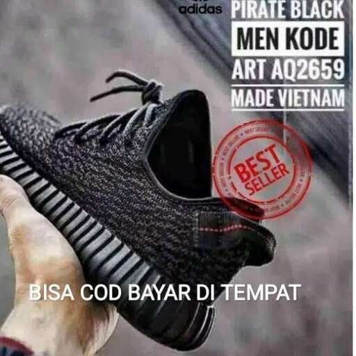 a black shoe with a black hat and a red logo