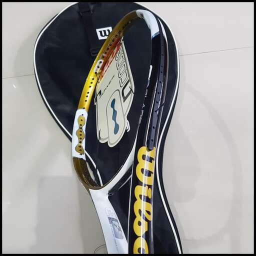 a guitar that has been painted in white and black.