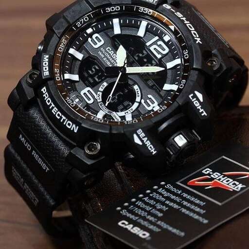 a black watch with a black case on top of it.