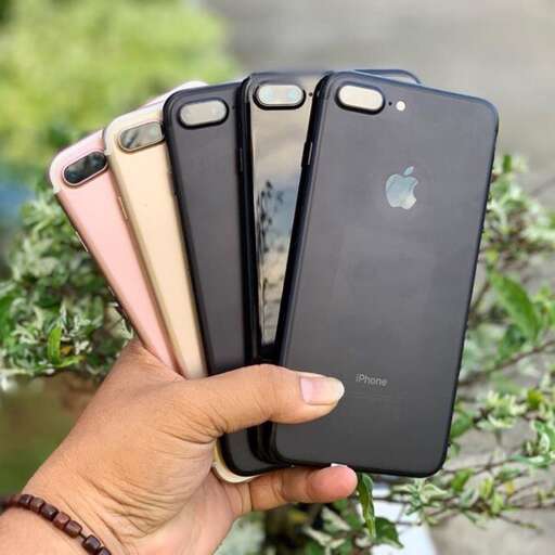 a person holding a phone in their hand.