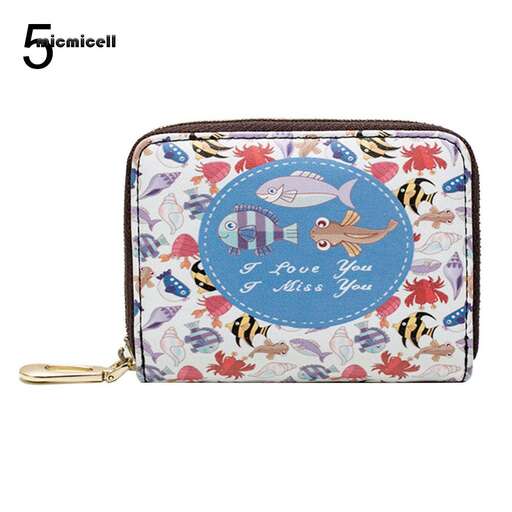 the bag is made of leather and has a cute little bird on it.